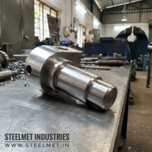 Close-up of machined fabrication hinge pin from bright steel bar